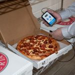 wireless-food-probe-taking-pizza-temperature